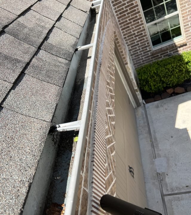 Professional gutter cleaning services in Woodlands, TX by Window Warriors